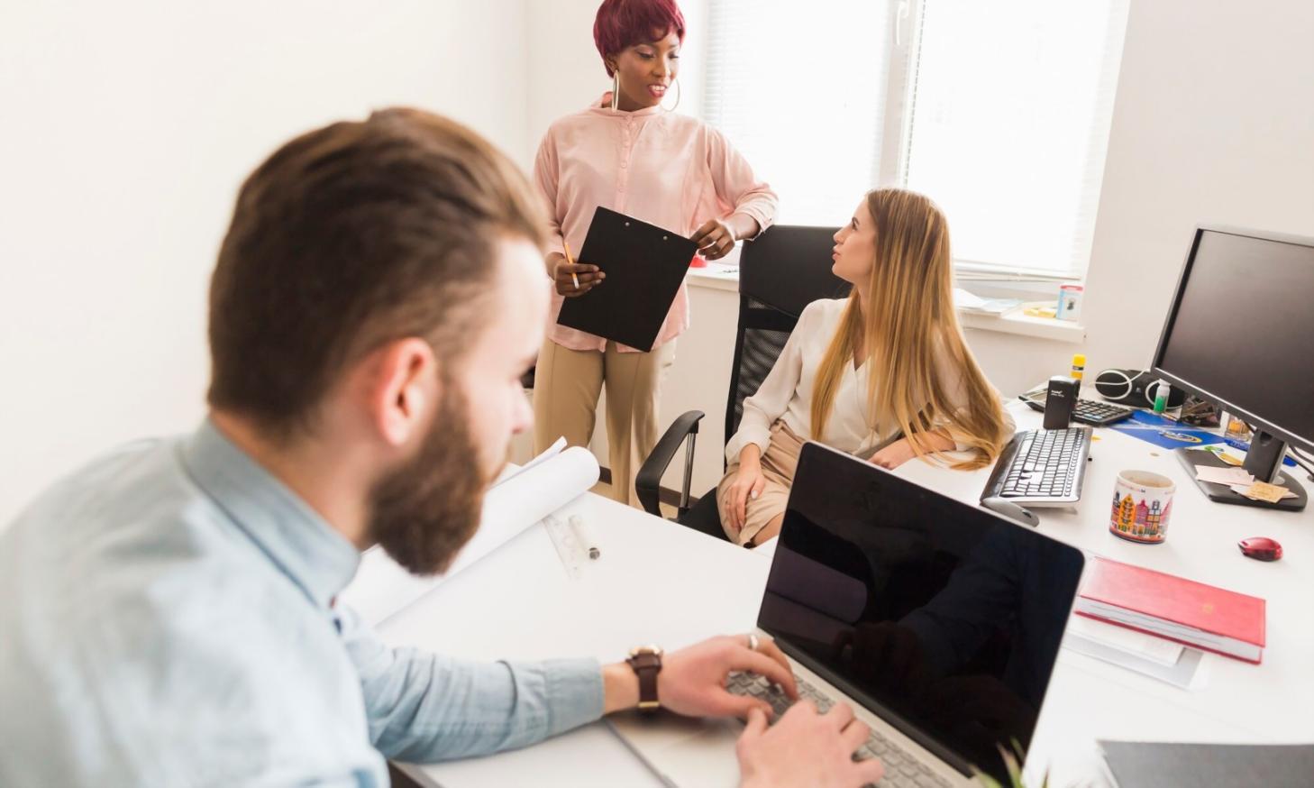 Students working with professional network equipment in hands-on training environment